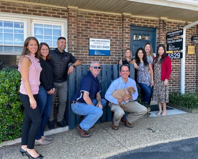 About Our Agency - Team Standing Together Outside Their Office Building